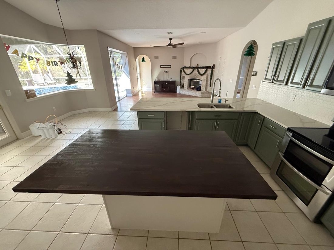 Cabinet refinishing, thermofoil doors, the same surface after the work was finished
