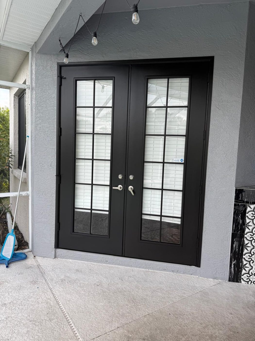 Door and trim refinishing on a job in Sarasota and Manatee County, FL