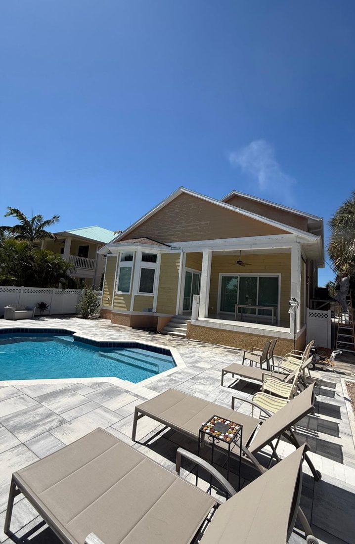 Exterior repaint, coastal two-story, the surface before the work started