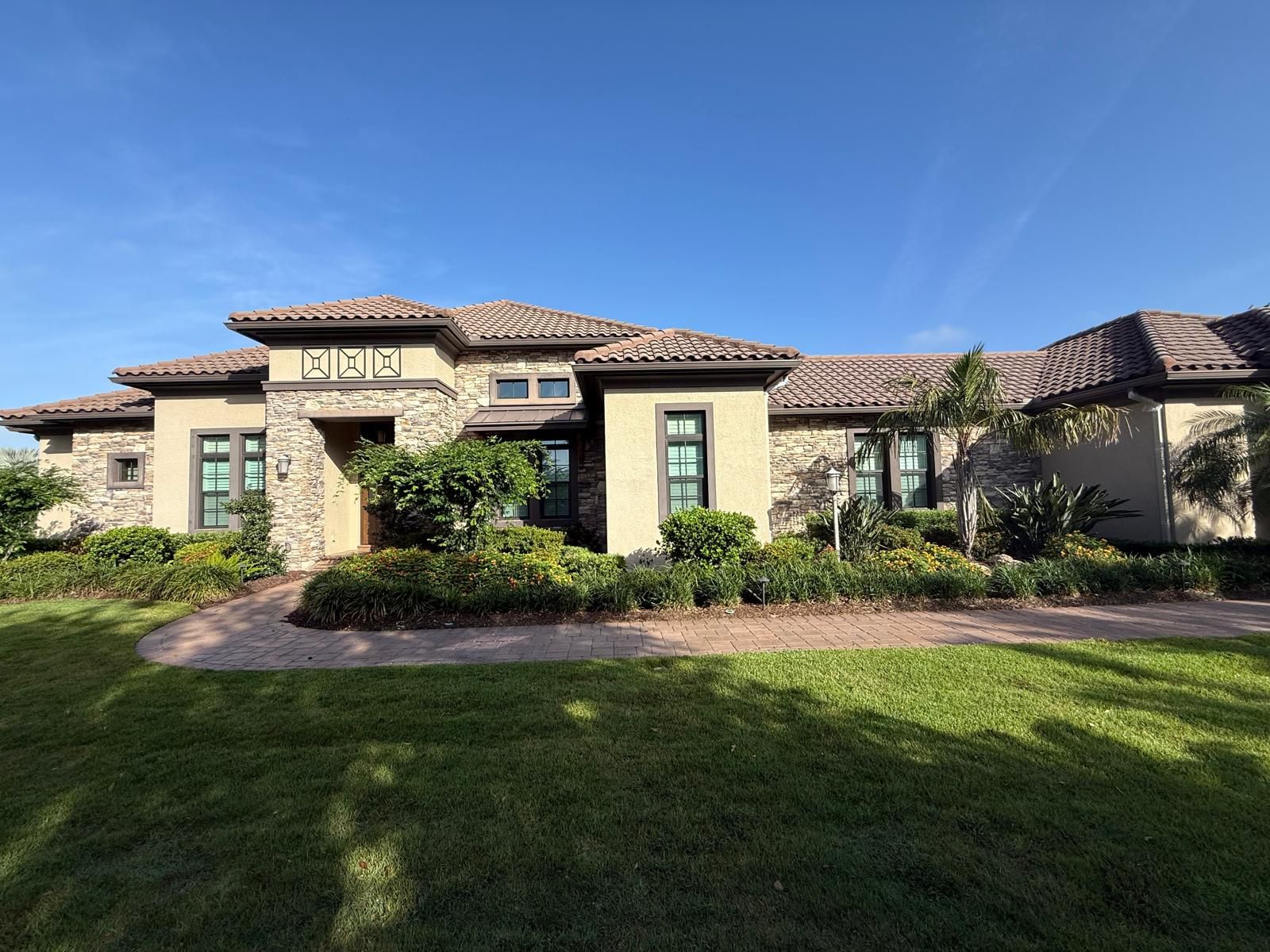 Exterior of a Gulf Coast Florida home with freshly painted stucco, trim and soffit