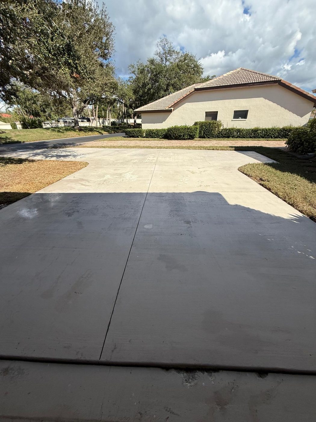Pressure washing, concrete driveway on a job in Sarasota and Manatee County, FL